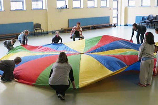 Children with large round flag